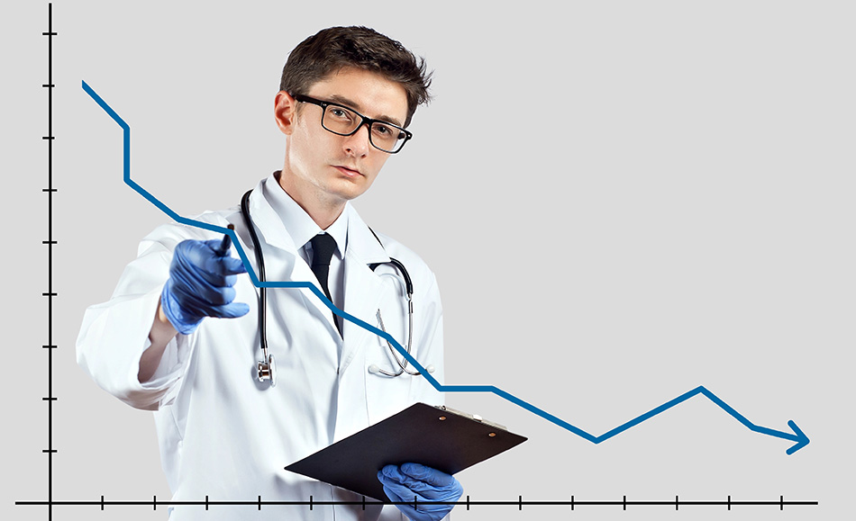 The doctor looks at the descending chart. The concept of reducing morbidity, vaccination and mortality. A man in a doctor's suit on a white background.