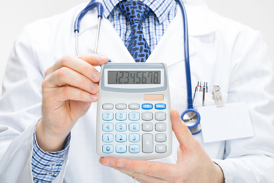 Doctor holding calculator in hands - health care concept